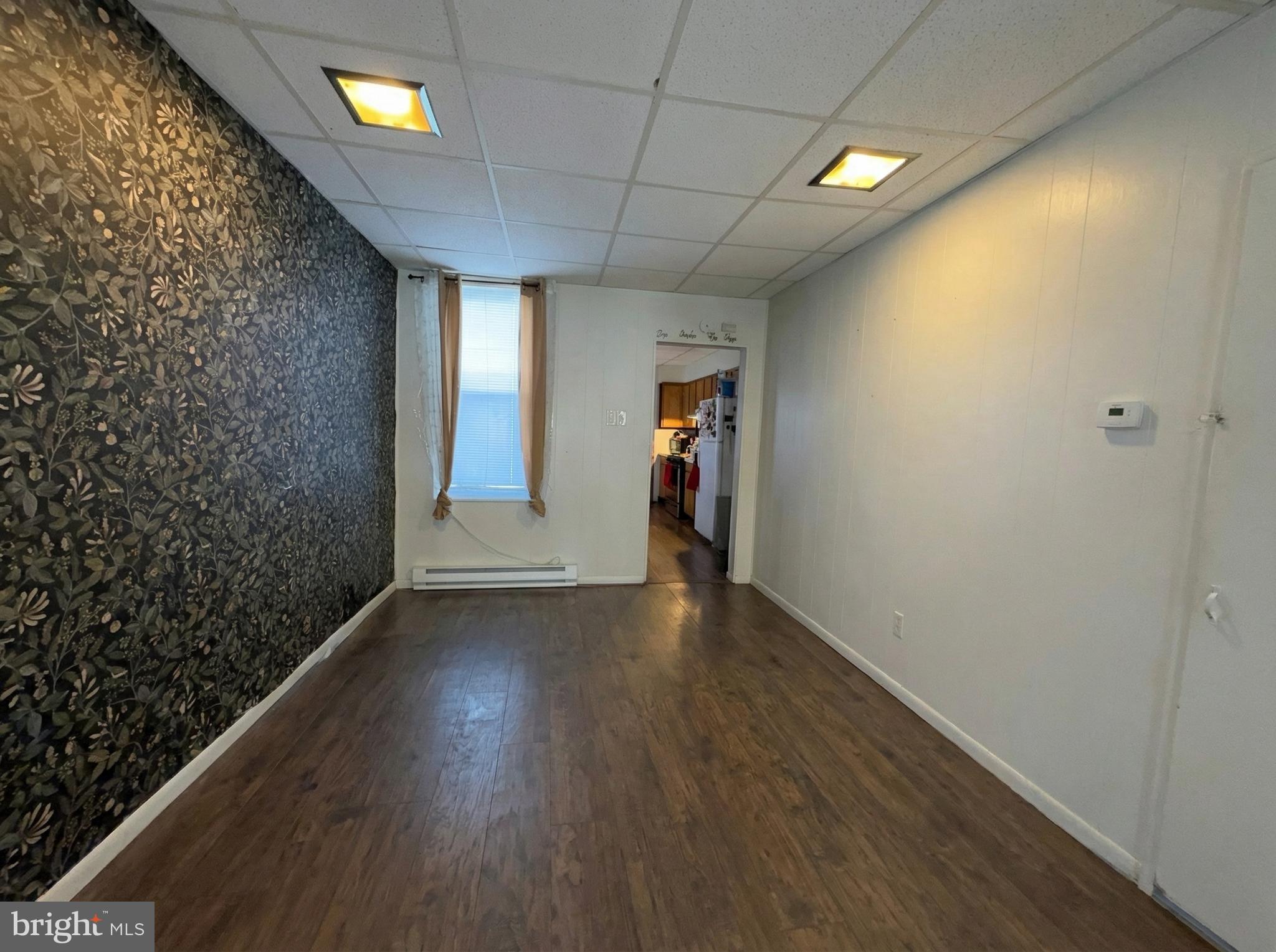 151 Arch Street York, PA 17401 - Photo 8 of 15 wooden floor in an empty room with a window