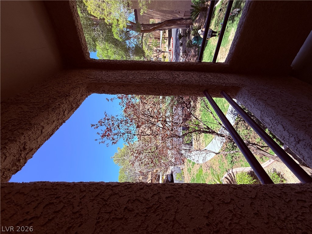 9325 West Desert Inn Road, Unit 260 Las Vegas, NV 89117 - Photo 26 of 42 Enjoy the peaceful neighborhood from this private, textured balcony offering tranquil views.