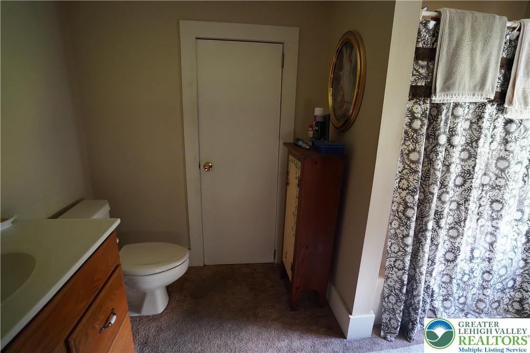 3065 Quarry Street Coplay, PA 18037 - Photo 15 of 19 a bathroom with a toilet and a shower