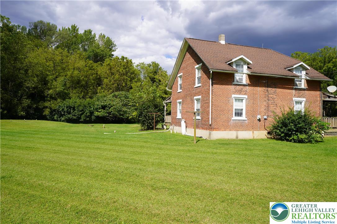 3065 Quarry Street Coplay, PA 18037 - Photo 4 of 19 a front view of a house with a garden