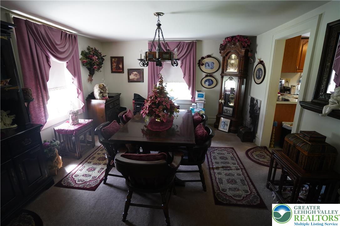 3065 Quarry Street Coplay, PA 18037 - Photo 7 of 19 a view of a dining room with furniture and chandelier