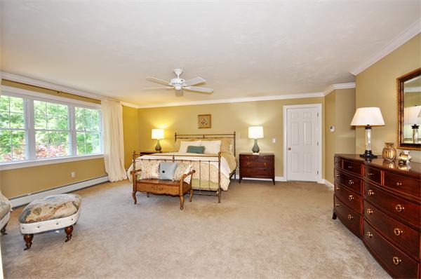 71 Chamberlain Road Westford, MA 01886 - Photo 16 of 30 a spacious bedroom with a bed and a window