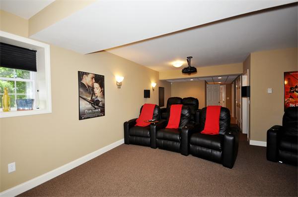 71 Chamberlain Road Westford, MA 01886 - Photo 25 of 30 a living room with furniture and a flat screen tv