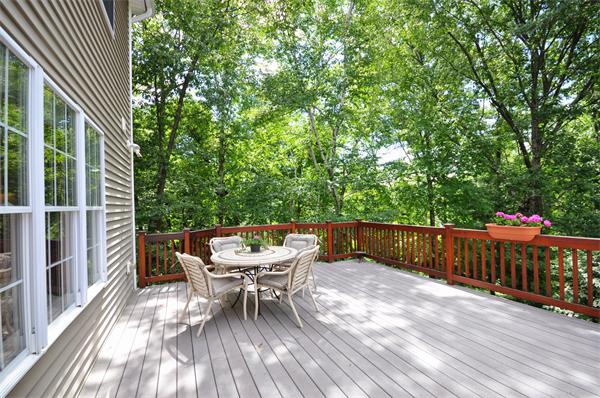 71 Chamberlain Road Westford, MA 01886 - Photo 27 of 30 a balcony with wooden floor and outdoor seating