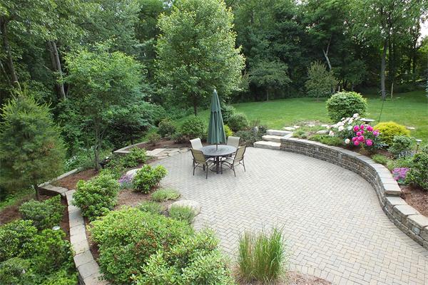 71 Chamberlain Road Westford, MA 01886 - Photo 28 of 30 a view of a patio with a table and chairs in a patio