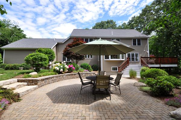 71 Chamberlain Road Westford, MA 01886 - Photo 29 of 30 a view of a backyard with sitting area and furniture