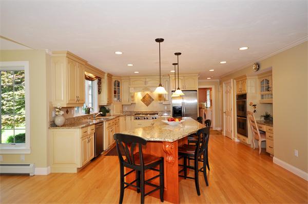 71 Chamberlain Road Westford, MA 01886 - Photo 8 of 30 a large kitchen with a table and chairs