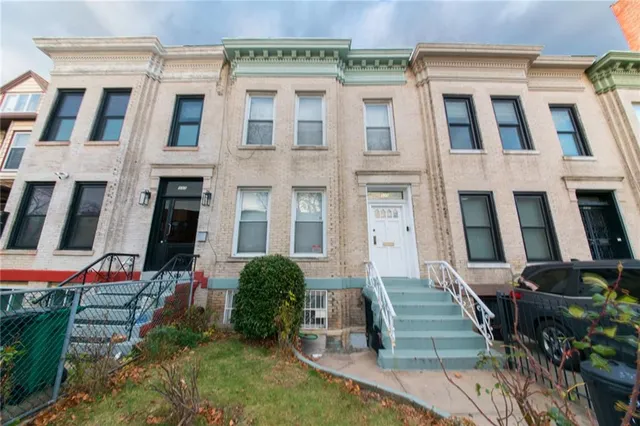 a front view of a multi story residential apartment building