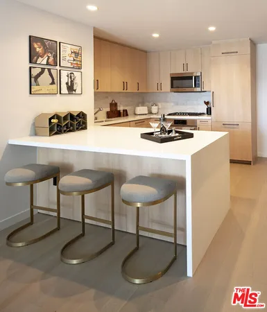 a kitchen with a cabinets and white appliances