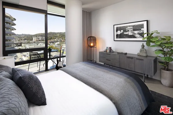 a bedroom with furniture and windows