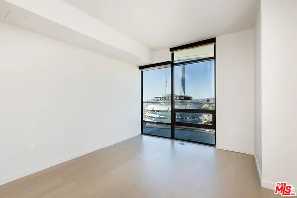 a view of a kitchen with refrigerator and stove