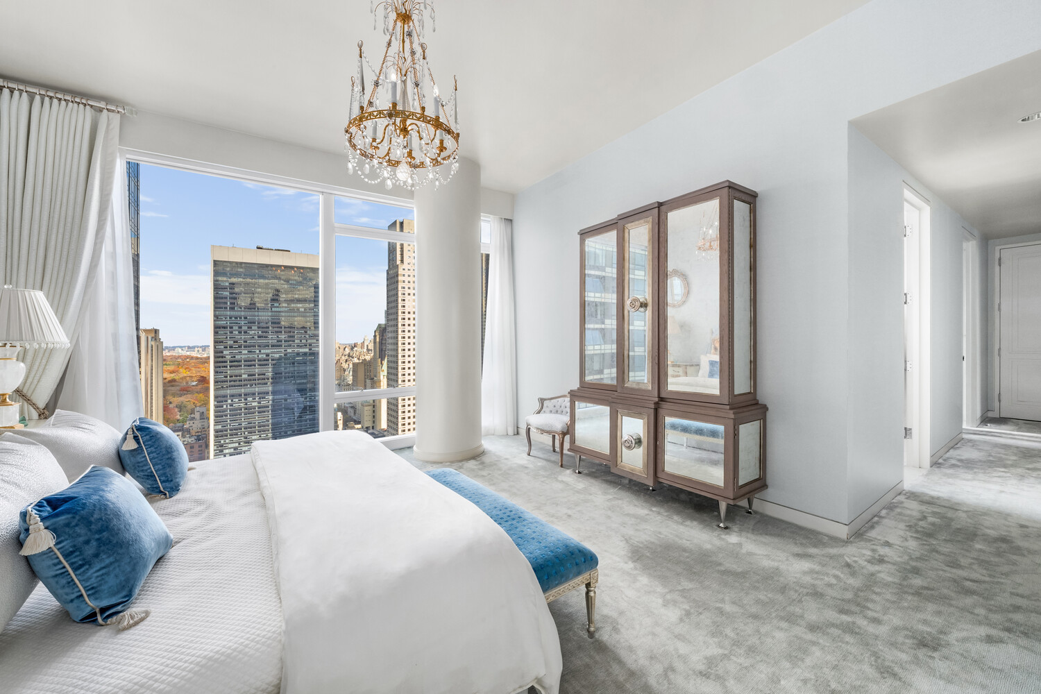 20 West 53rd Street, Unit 38A Manhattan, NY 10019 - Photo 10 of 20 a spacious bedroom with a bed and a window