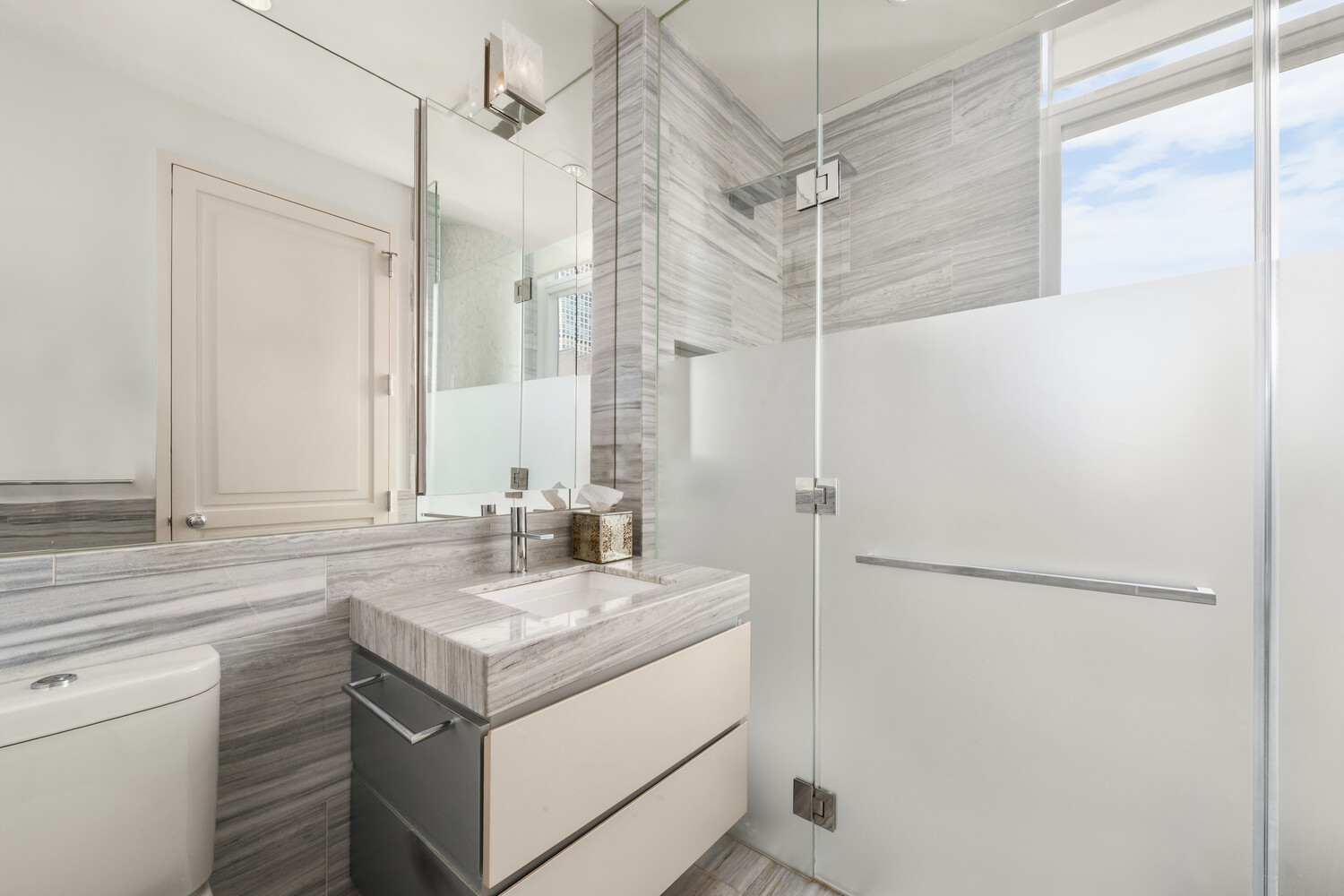 20 West 53rd Street, Unit 38A Manhattan, NY 10019 - Photo 15 of 20 a bathroom with a sink and a mirror