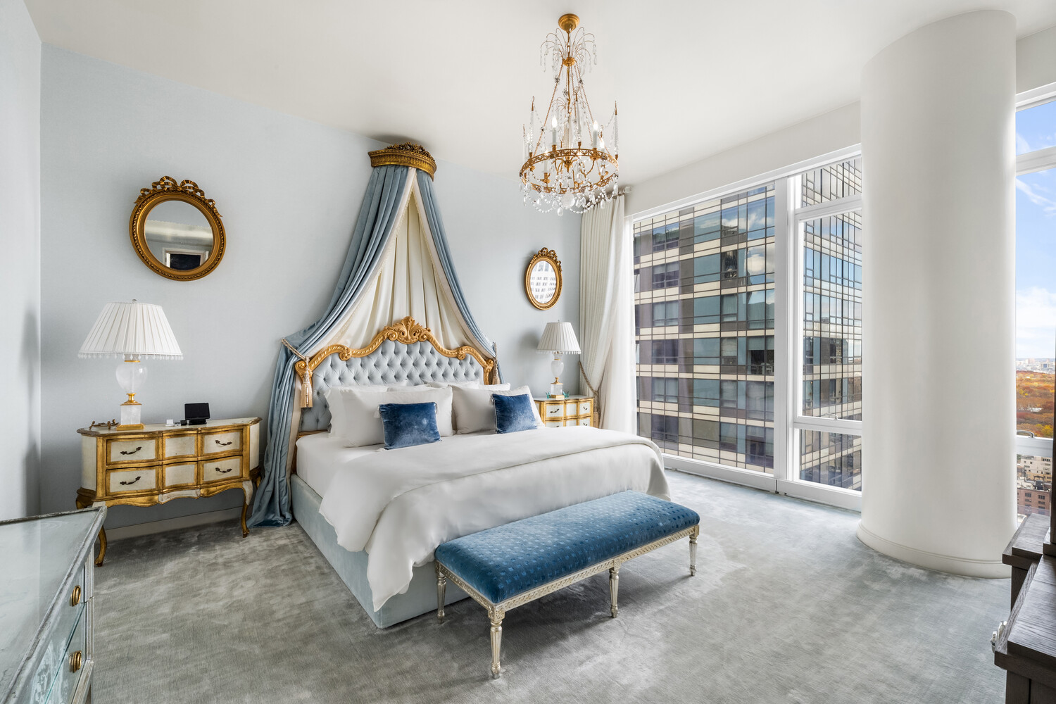 20 West 53rd Street, Unit 38A Manhattan, NY 10019 - Photo 9 of 20 a spacious bedroom with a bed and a large window