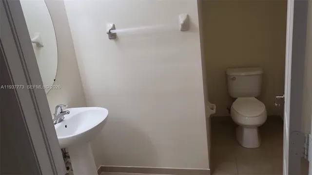 a bathroom with a toilet and a sink
