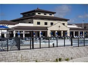 a view of a house with wooden deck