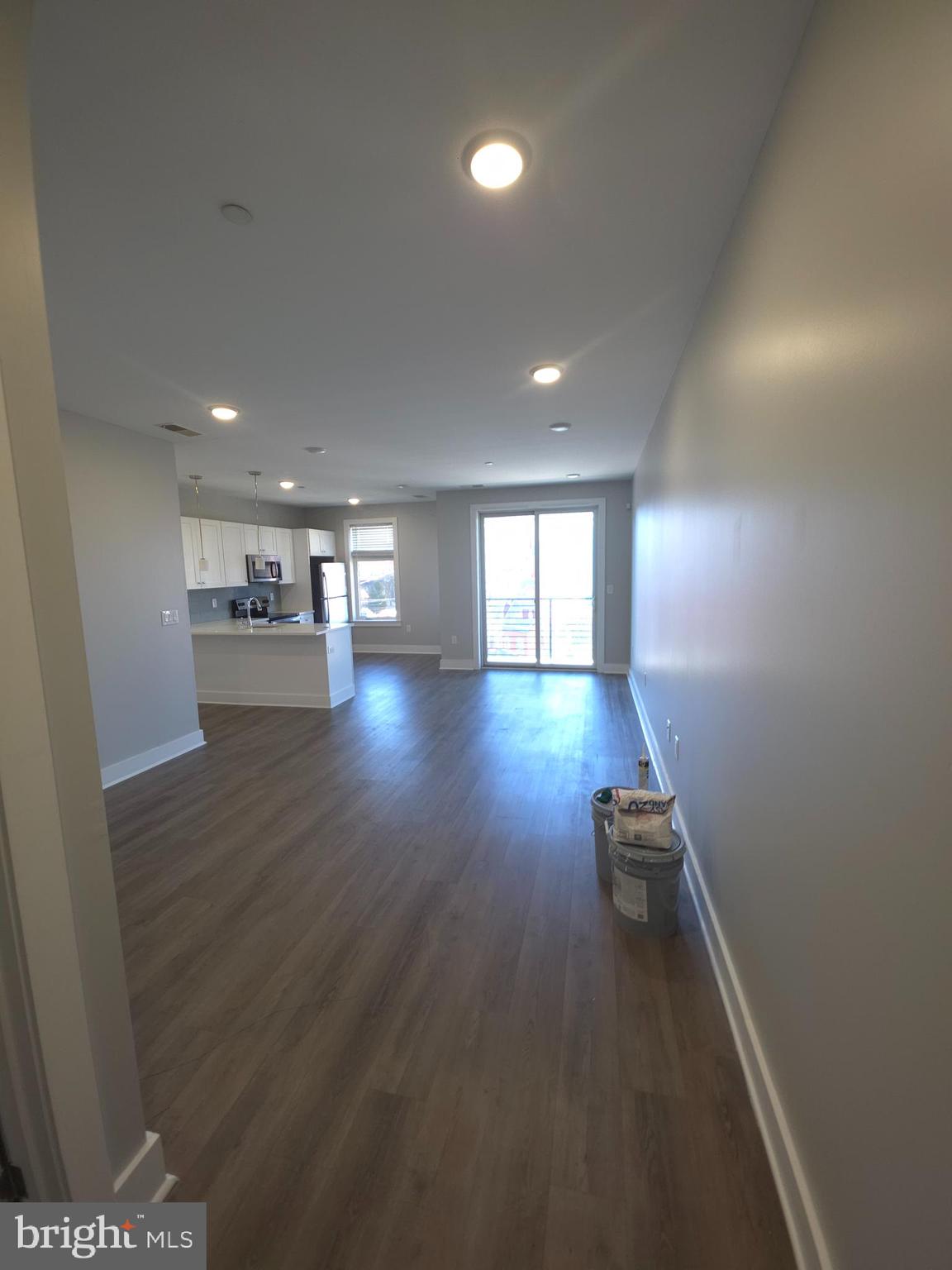 3925 Haverford Avenue, Unit 307 Philadelphia, PA 19104 - Photo 19 of 37 an empty room with wooden floor and windows