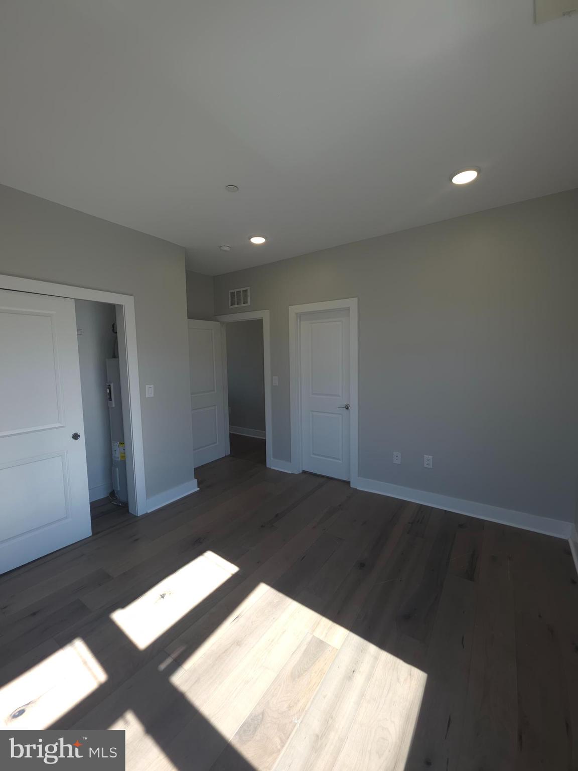 3925 Haverford Avenue, Unit 307 Philadelphia, PA 19104 - Photo 25 of 37 a view of an empty room with wooden floor and a window