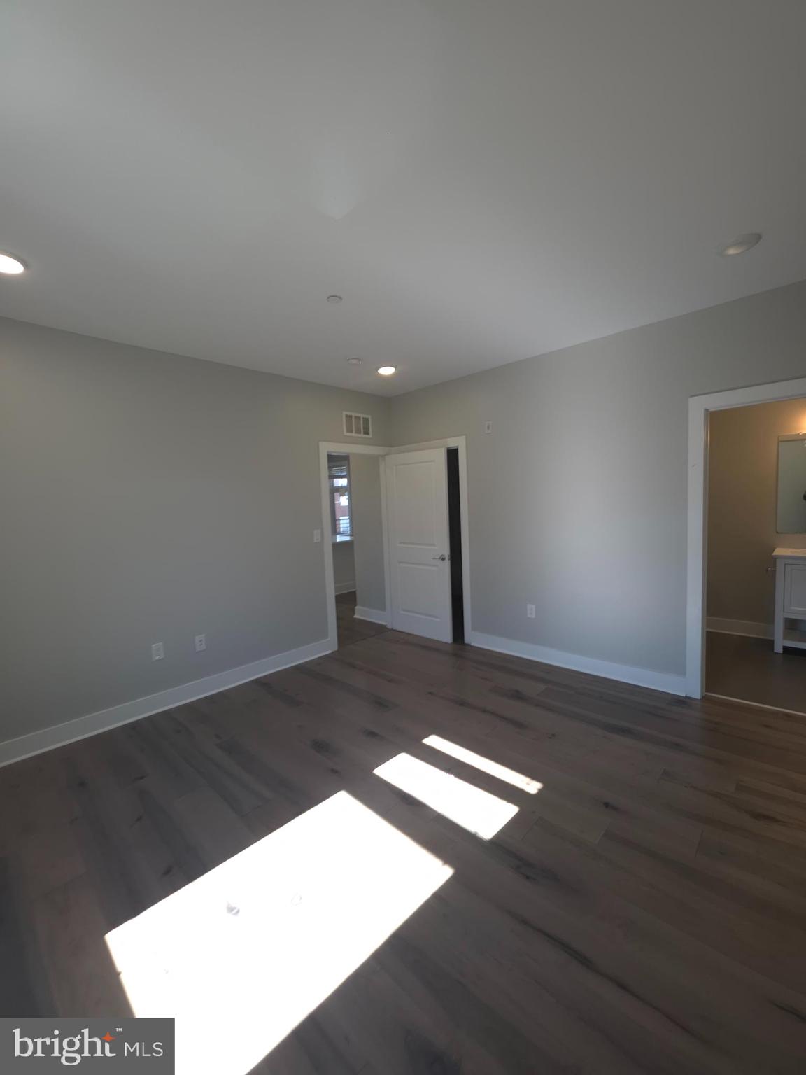 3925 Haverford Avenue, Unit 307 Philadelphia, PA 19104 - Photo 28 of 37 a view of an empty room with wooden floor
