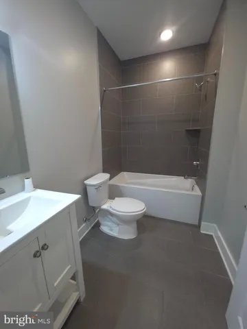 a bathroom with a toilet a sink and a bathtub
