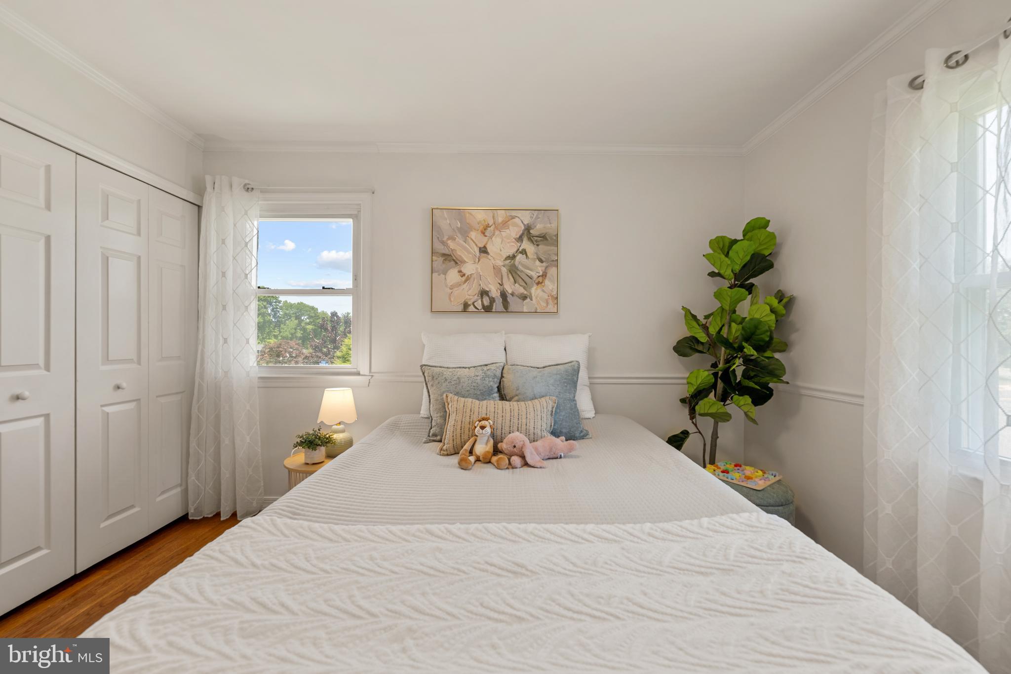 6800 Seton Court Springfield, VA 22152 - Photo 24 of 51 a bedroom with a bed and a potted plant