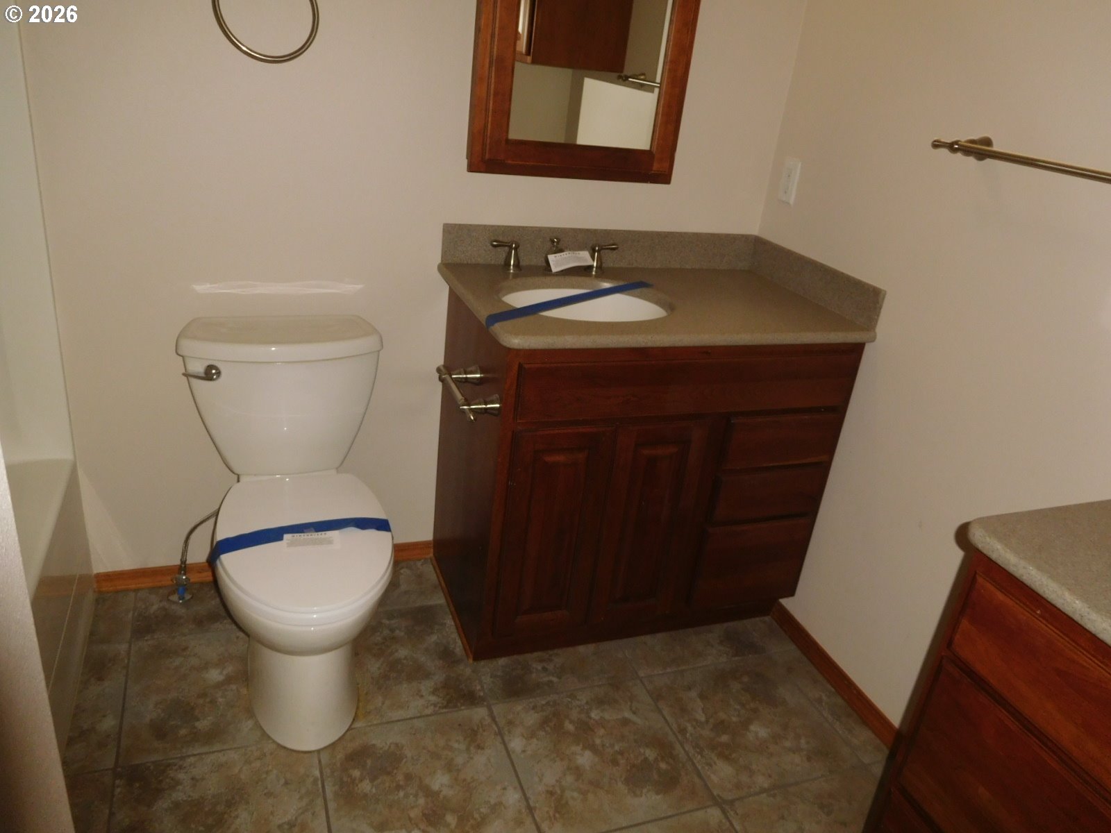 815 North Main Street Pendleton, OR 97801 - Photo 17 of 35 a bathroom with a toilet and a sink