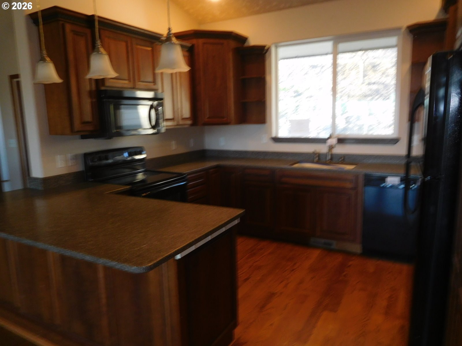 815 North Main Street Pendleton, OR 97801 - Photo 21 of 35 a kitchen with a sink stove and refrigerator