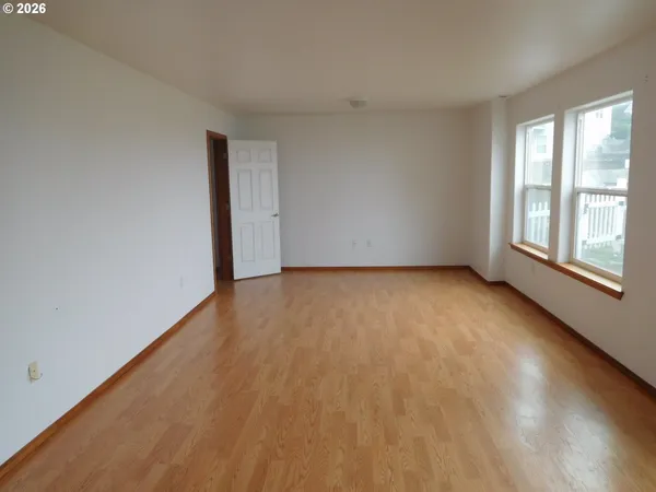 a room with cabinet and windows