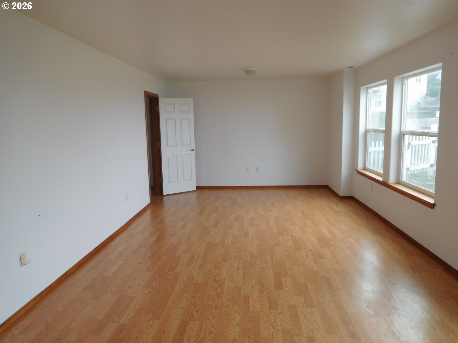 815 North Main Street Pendleton, OR 97801 - Photo 24 of 35 an empty room with wooden floor and windows