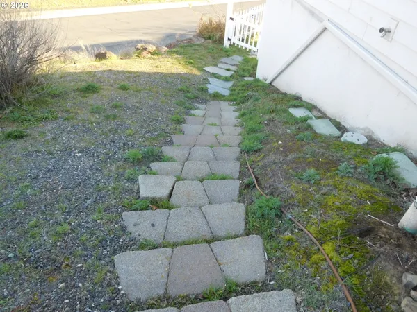 a view of a house with a yard and wooden floor
