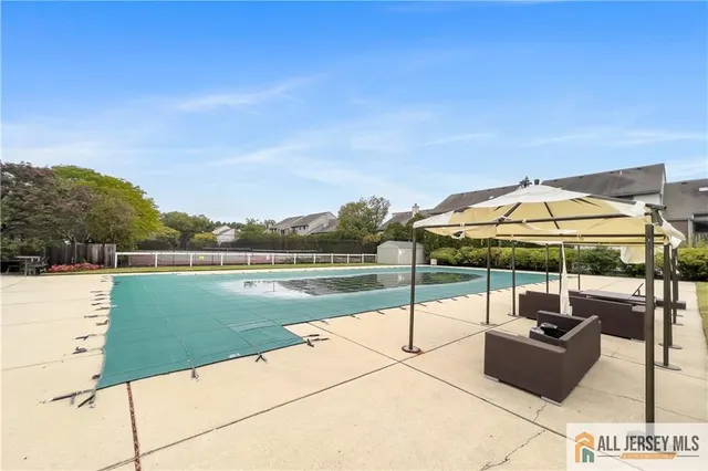 a view of a patio with swimming pool