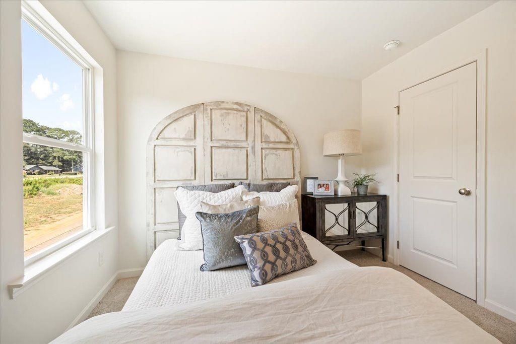 2526 Riverside Court Northeast Conyers, GA 30013 - Photo 12 of 22 a living room with furniture and a large window