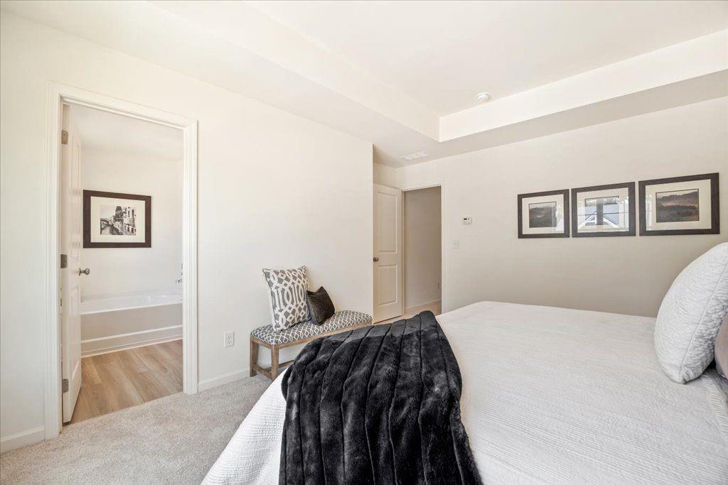 2526 Riverside Court Northeast Conyers, GA 30013 - Photo 17 of 22 a bedroom with a bed and a painting on the wall