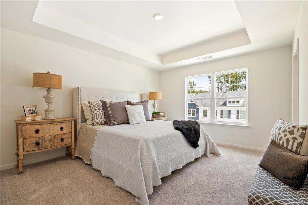 2526 Riverside Court Northeast Conyers, GA 30013 - Photo 18 of 22 a bedroom with a bed and a window