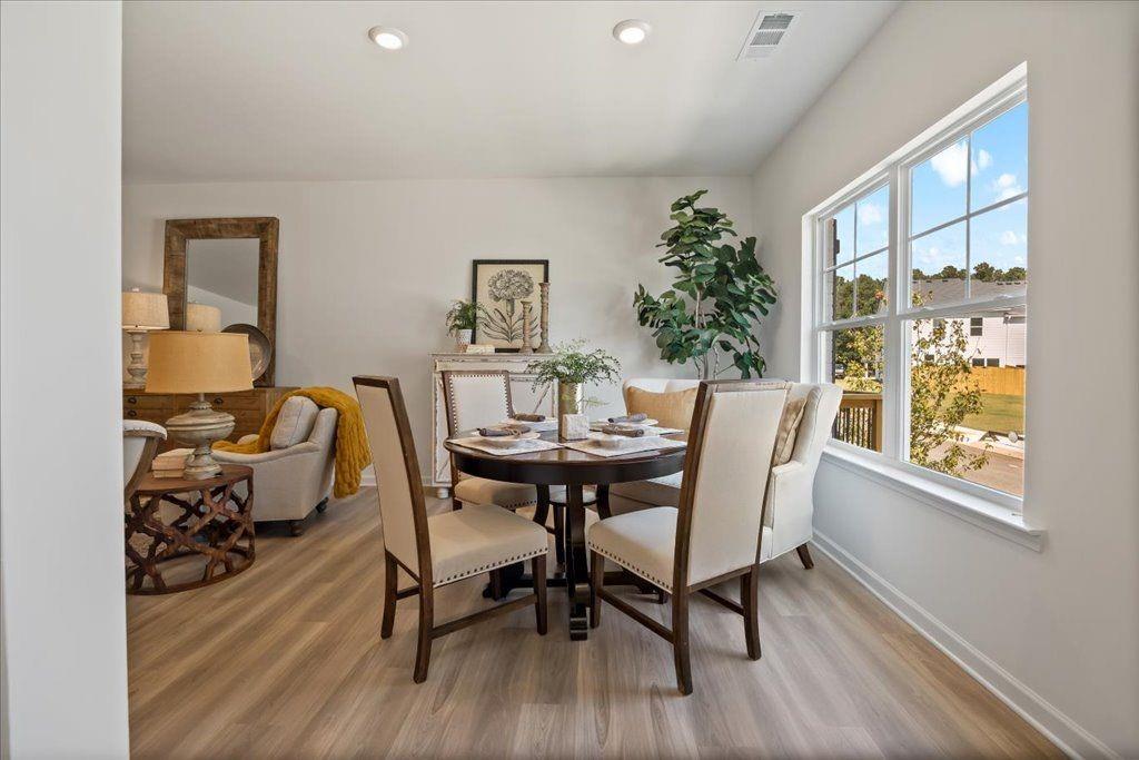 2526 Riverside Court Northeast Conyers, GA 30013 - Photo 3 of 22 a view of a dining room with furniture and wooden floor