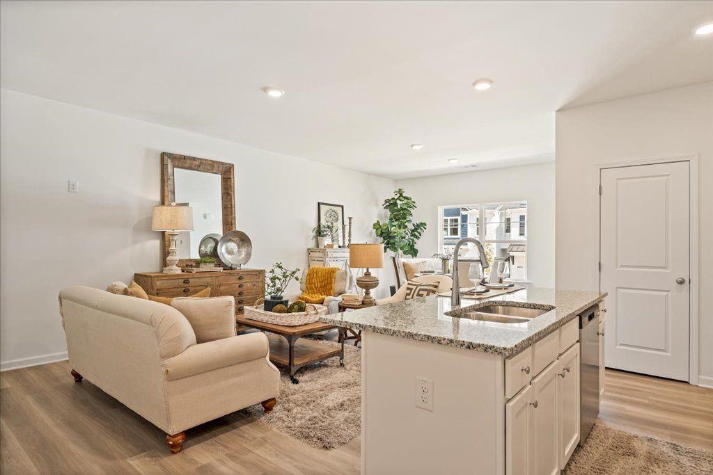 2526 Riverside Court Northeast Conyers, GA 30013 - Photo 5 of 22 a living room with furniture and a wooden floor