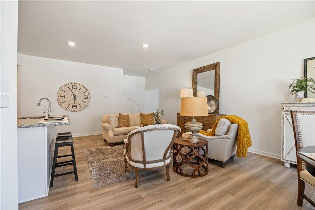 2526 Riverside Court Northeast Conyers, GA 30013 - Photo 6 of 22 a living room with furniture and a wooden floor