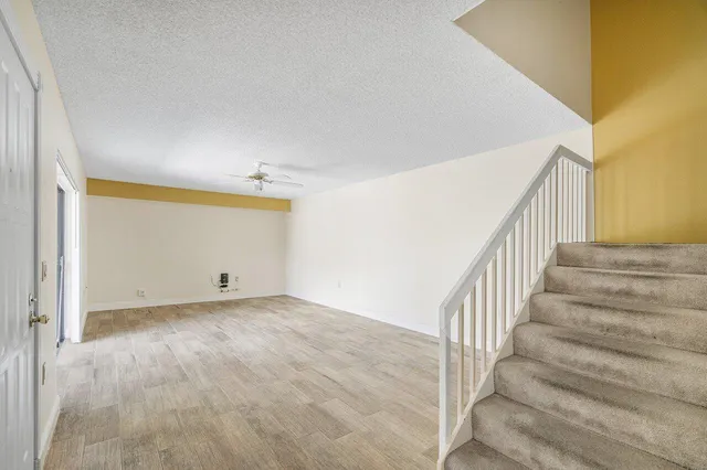 an empty room with wooden floor