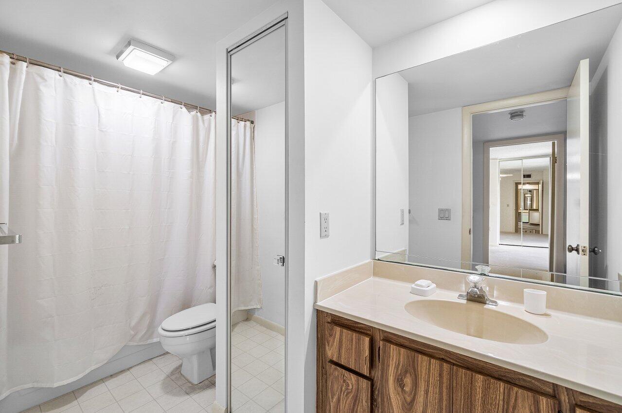 1619 16th Court Jupiter, FL 33477 - Photo 18 of 31 a bathroom with a sink a toilet and shower