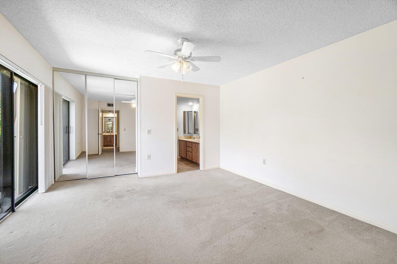 1619 16th Court Jupiter, FL 33477 - Photo 21 of 31 a view of empty room with a ceiling fan
