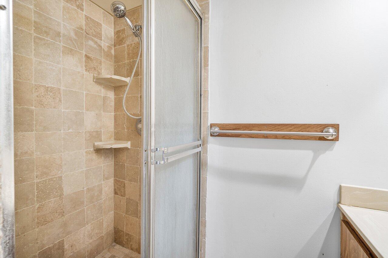 1619 16th Court Jupiter, FL 33477 - Photo 24 of 31 a bathroom with a shower