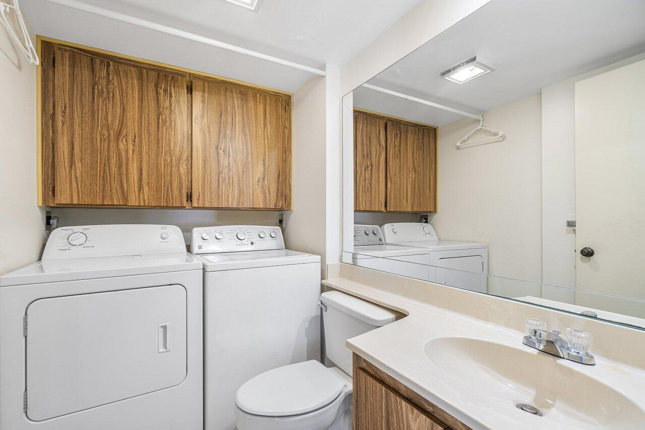 1619 16th Court Jupiter, FL 33477 - Photo 27 of 31 a bathroom with a sink a toilet and vanity