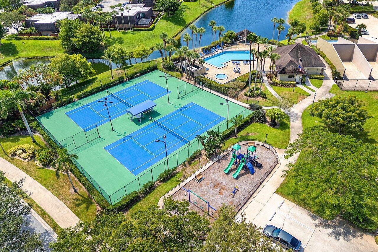 1619 16th Court Jupiter, FL 33477 - Photo 28 of 31 an aerial view of a tennis ground and a cars park side of the road