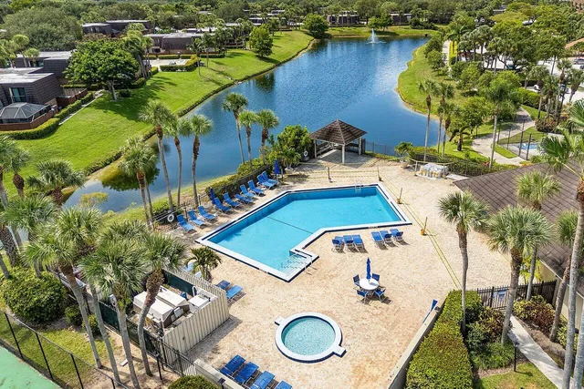 an aerial view of residential house with outdoor space and swimming pool