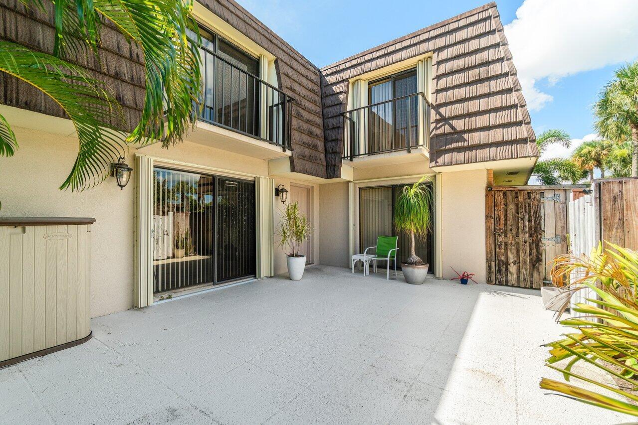 1619 16th Court Jupiter, FL 33477 - Photo 6 of 31 a view of a building with a outdoor space