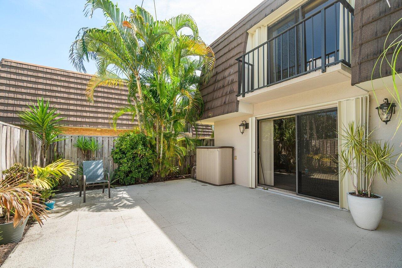 1619 16th Court Jupiter, FL 33477 - Photo 7 of 31 a view of a house with backyard and sitting area