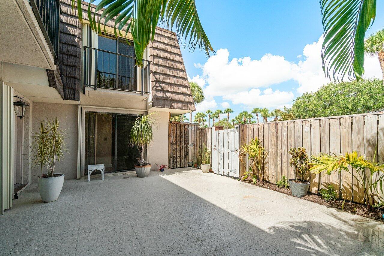 1619 16th Court Jupiter, FL 33477 - Photo 8 of 31 a view of a house with backyard and sitting area