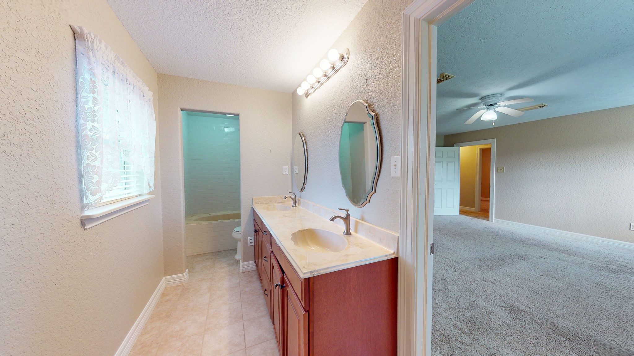 4770 County Road 31 Angleton, TX 77515 - Photo 16 of 44 Primary bath with primary bedroom view