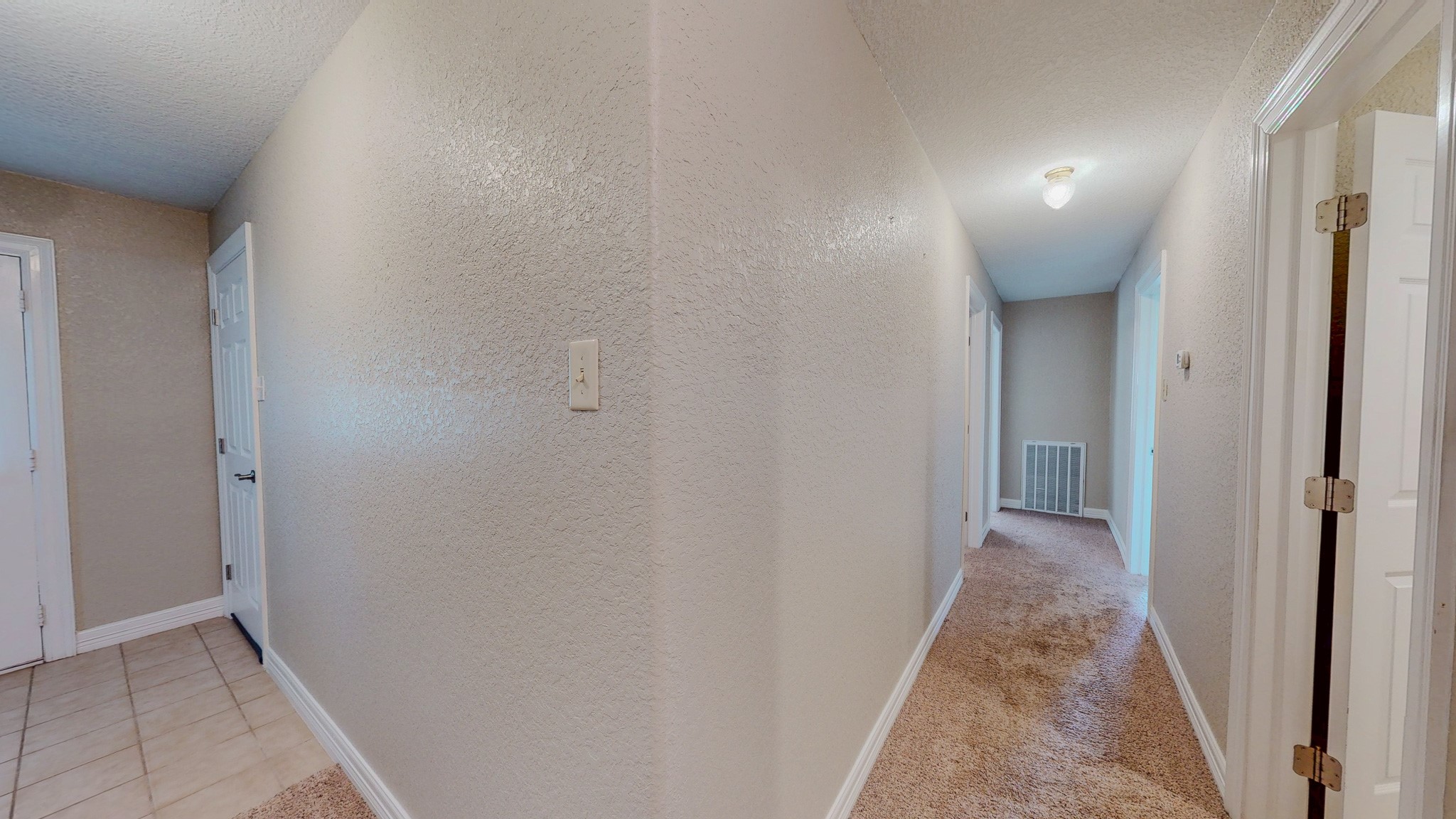4770 County Road 31 Angleton, TX 77515 - Photo 21 of 44 View of entry and hall to bedrooms from kitchen/dining