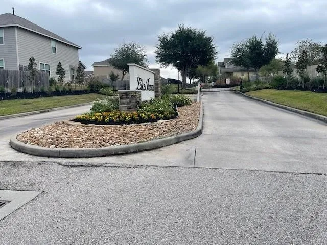 a view of a garden with a house